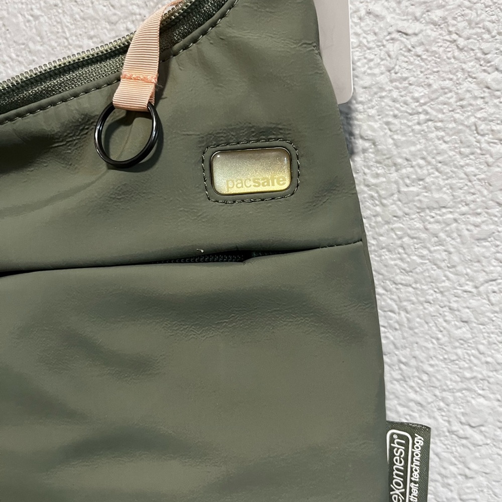 Pacsafe Olive Green Anti-Theft Sling Belt Bag with Peach Accent